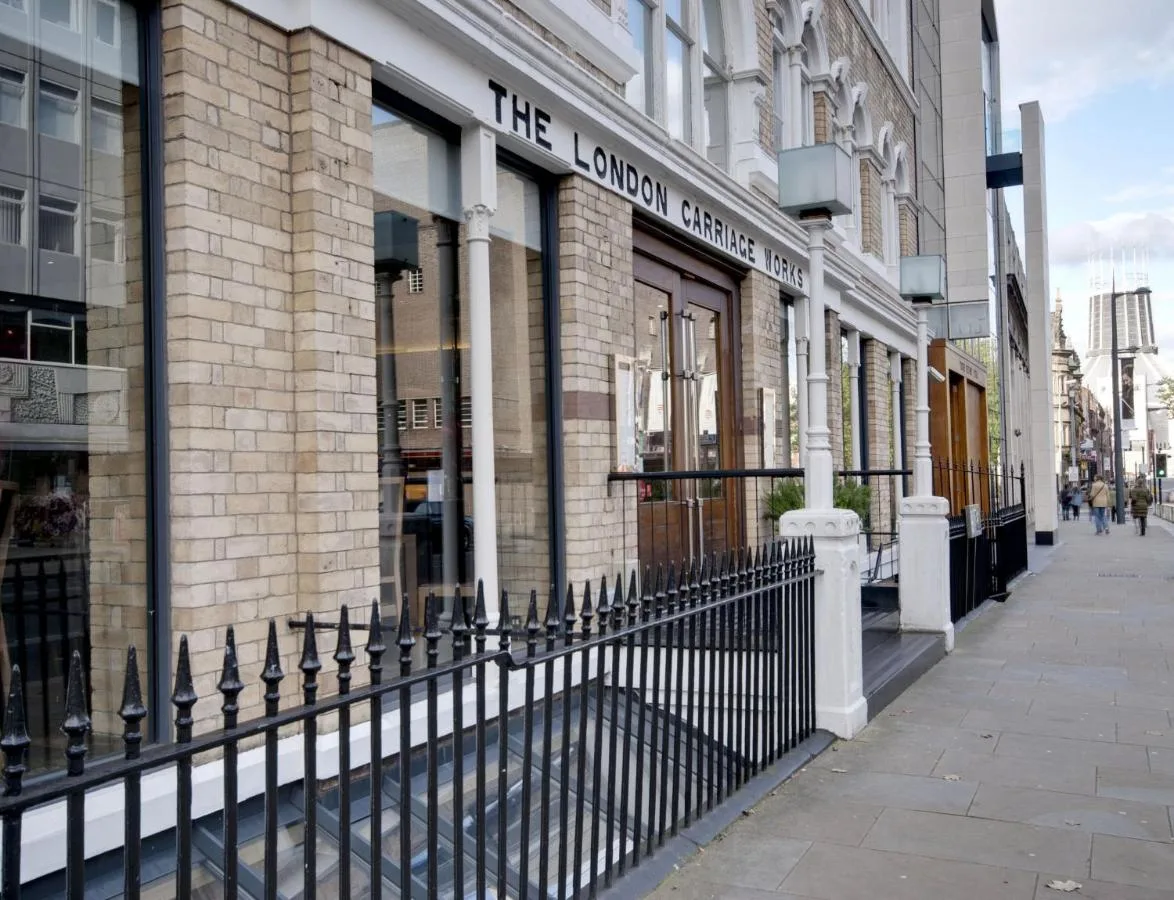 a building with a fence in front of a store at Hope Street Hotel in Liverpool