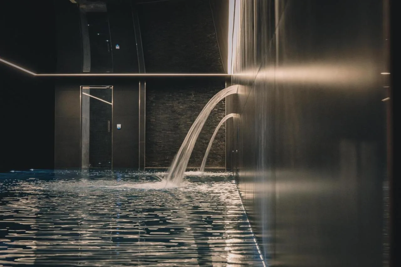 a pool of water with a fountain in front of a building at Hope Street Hotel in Liverpool